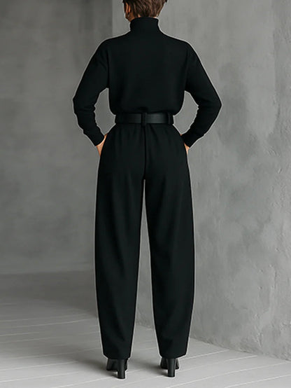 Back view of the black set on a model, showing the plain back of the top and belt 2