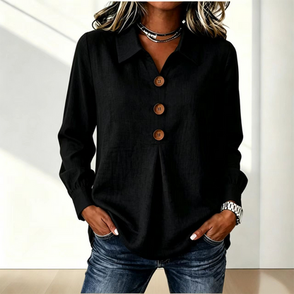 Black version of the shirt styled with jeans and a layered necklace 4
