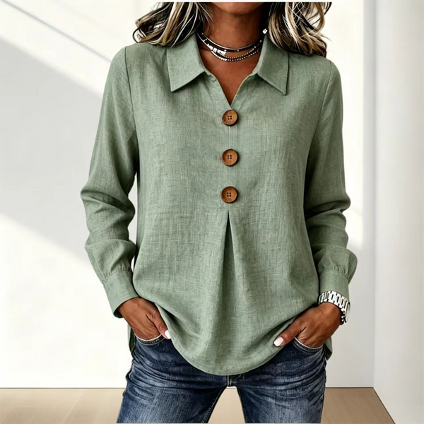 Sage green version of the shirt worn with jeans, showing collar and wooden buttons 7