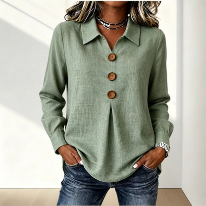 Sage green version of the shirt worn with jeans, showing collar and wooden buttons 7