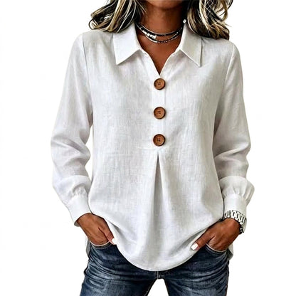 White long sleeve shirt with three wooden buttons, worn with jeans, hands in pockets 1