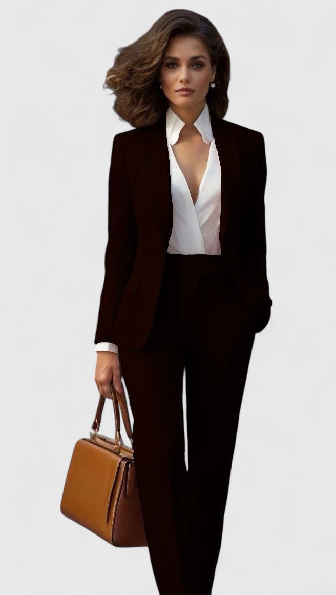 Model wearing the set in black with a white wrap blouse and tan handbag 7