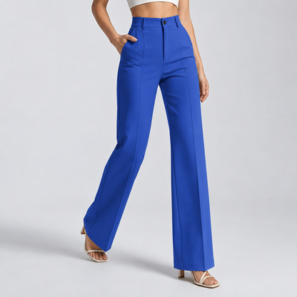 Bright royal blue trousers on a model mid-stride with one hand in the pocket 15