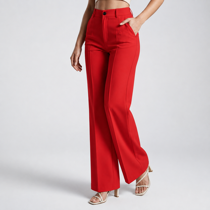 Red wide-leg trousers on a model with one hand in the pocket, three-quarter view 16