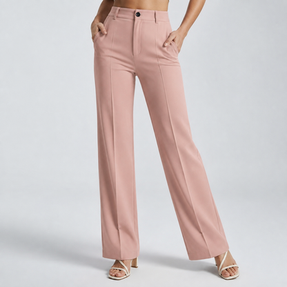 Dusty pink trousers on a model with both hands in the pockets, front view 18