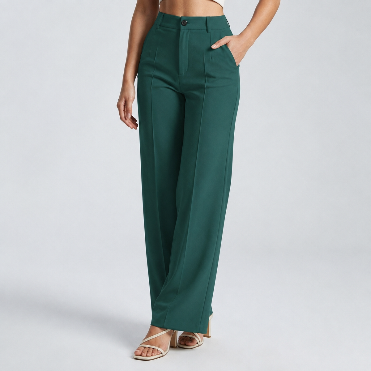 Dark green trousers on a model with one hand in the pocket, front view 19