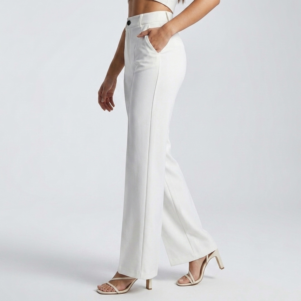 Side view of white trousers on a model walking, one hand in the side pocket 4