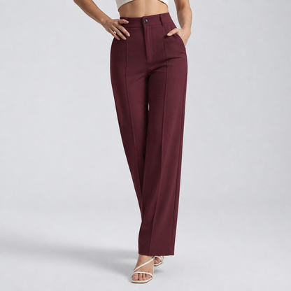 Burgundy trousers on a model with one hand on the hip and one in a pocket 9