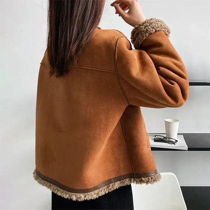 Back view of the tan suede jacket showing seam details and fleecy trim at the hem and cuff 3
