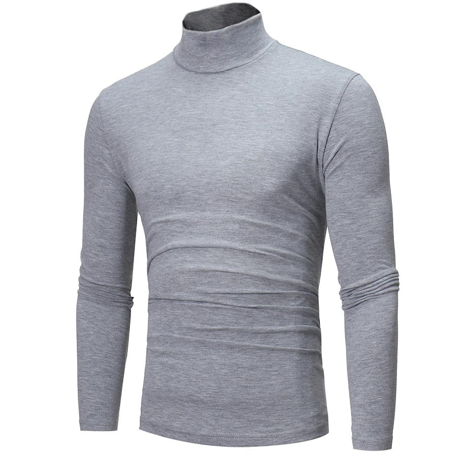 Three-quarter angled view of the light grey marl high neck top showing its fitted shape 8