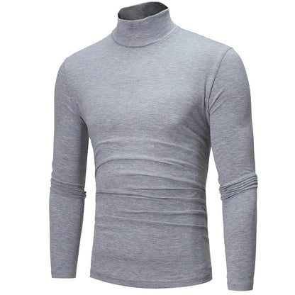 Three-quarter angled view of the light grey marl high neck top showing its fitted shape 8