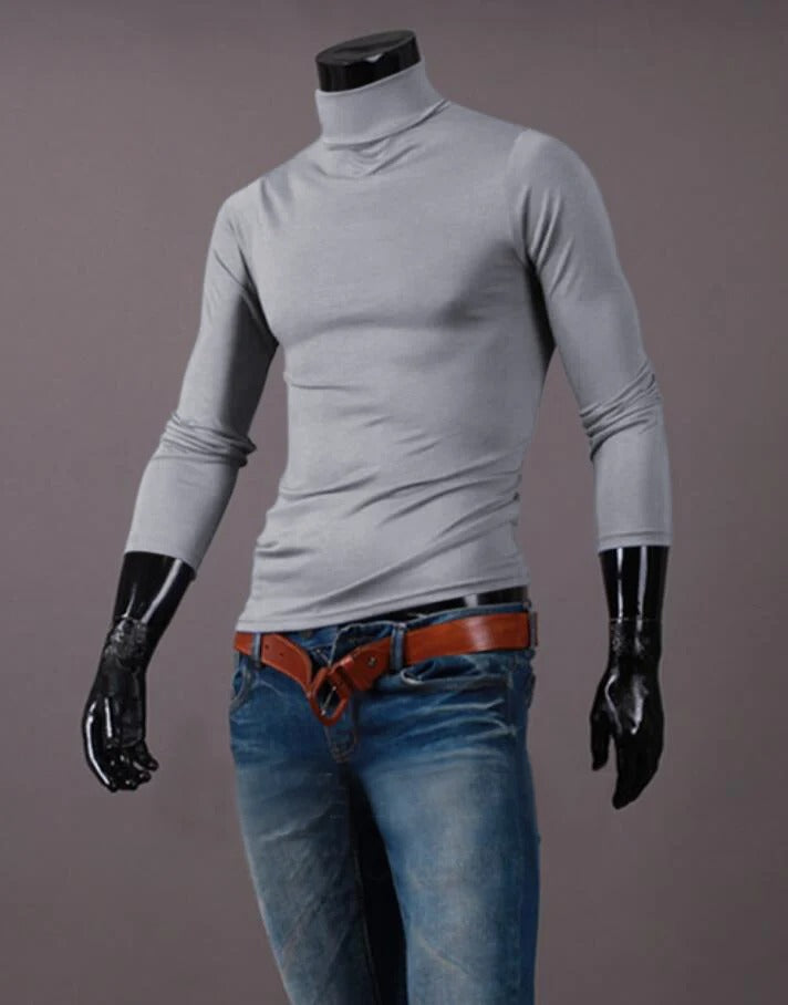 Light grey high neck top styled on a headless mannequin with blue jeans and a tan belt 12