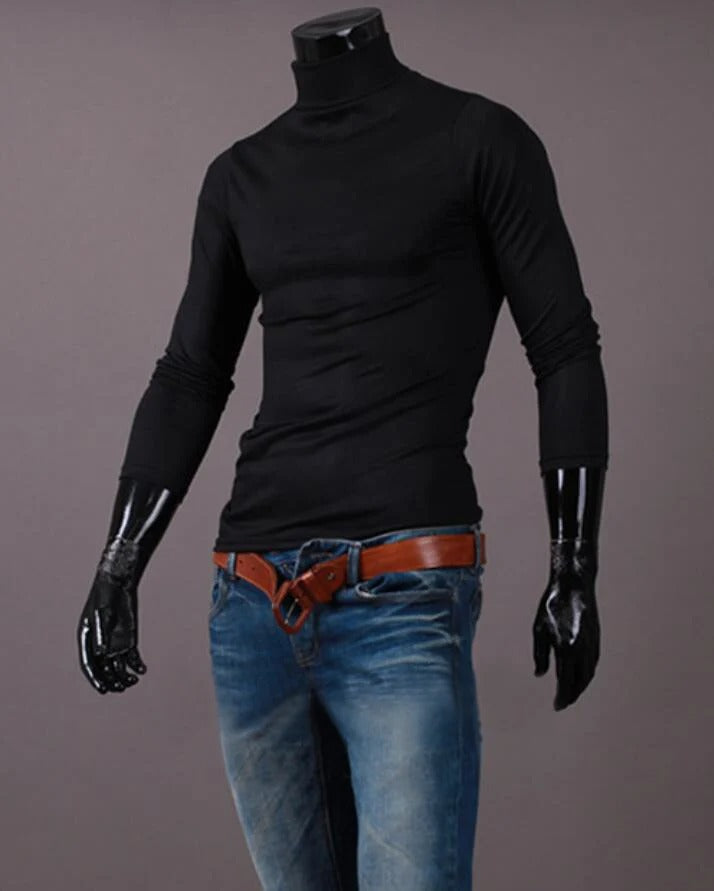 Black high neck top styled on a headless mannequin with blue jeans and a tan leather belt 10