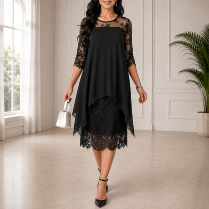 Woman wearing the black version, with lace yoke and sleeves, an asymmetric chiffon overlay above a lace skirt, white handbag in hand. 2