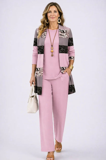 Model wears the pink set with a colour-block cardigan in grey and black speckled panels 12