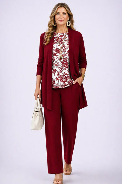 Model wears a plain red cardigan and trousers with a red and white floral printed top 13