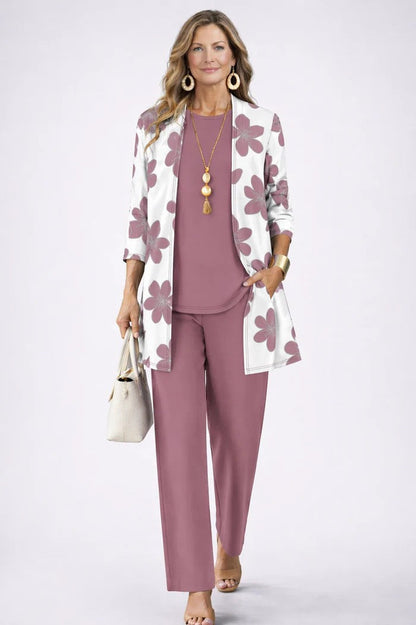 Model wears the mauve set with a white open cardigan printed with large mauve flowers 18