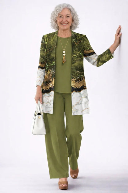 Smiling older model wears the olive set, the cardigan in a green, white and gold marble print 19