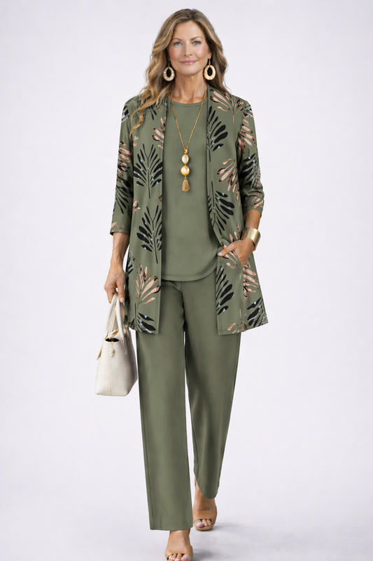 Model wears the olive green set, the open cardigan printed with black and blush leaves, one hand in pocket 2