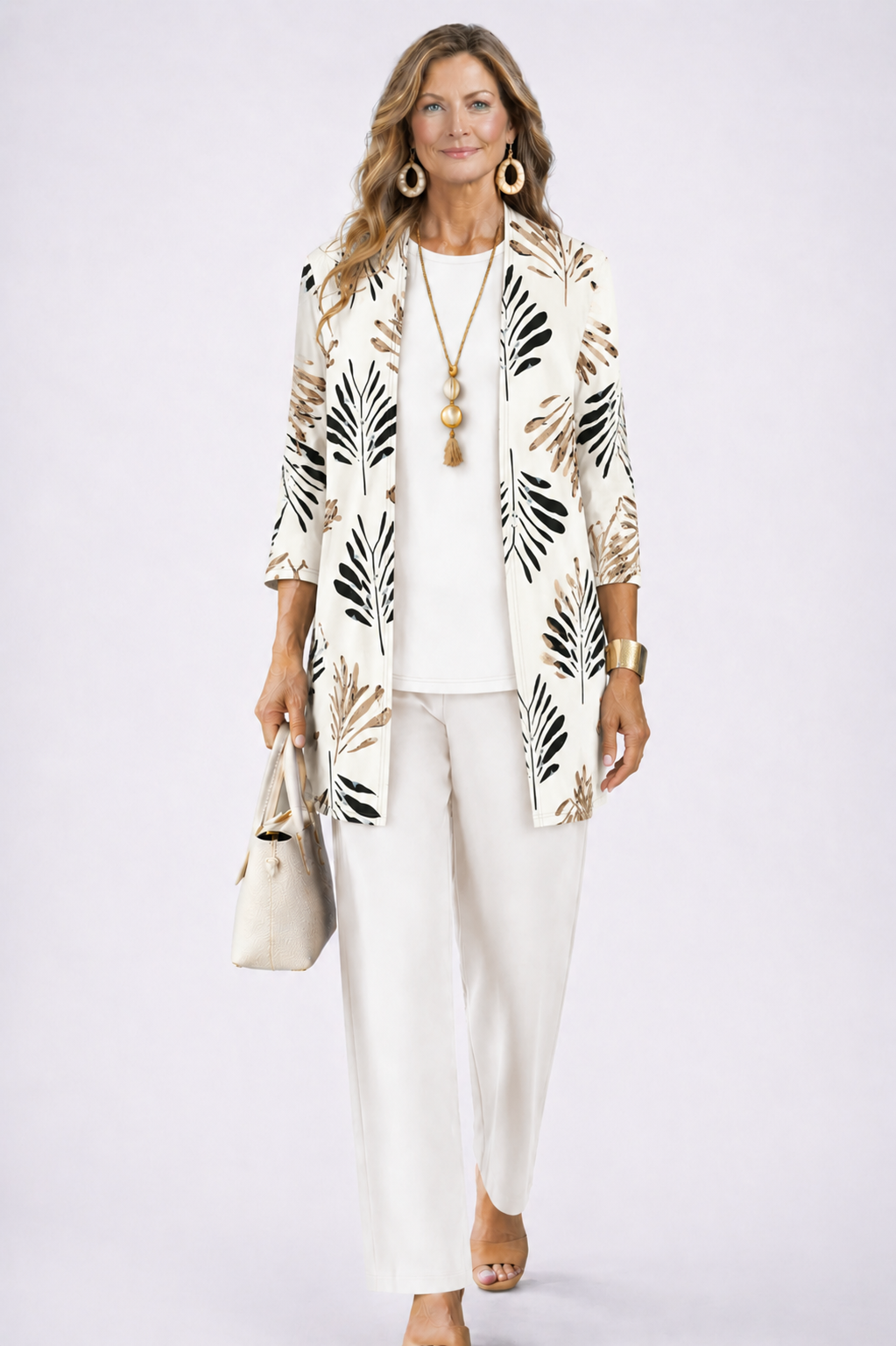 Model wears the white set, the open cardigan printed with black and tan palm leaves 4