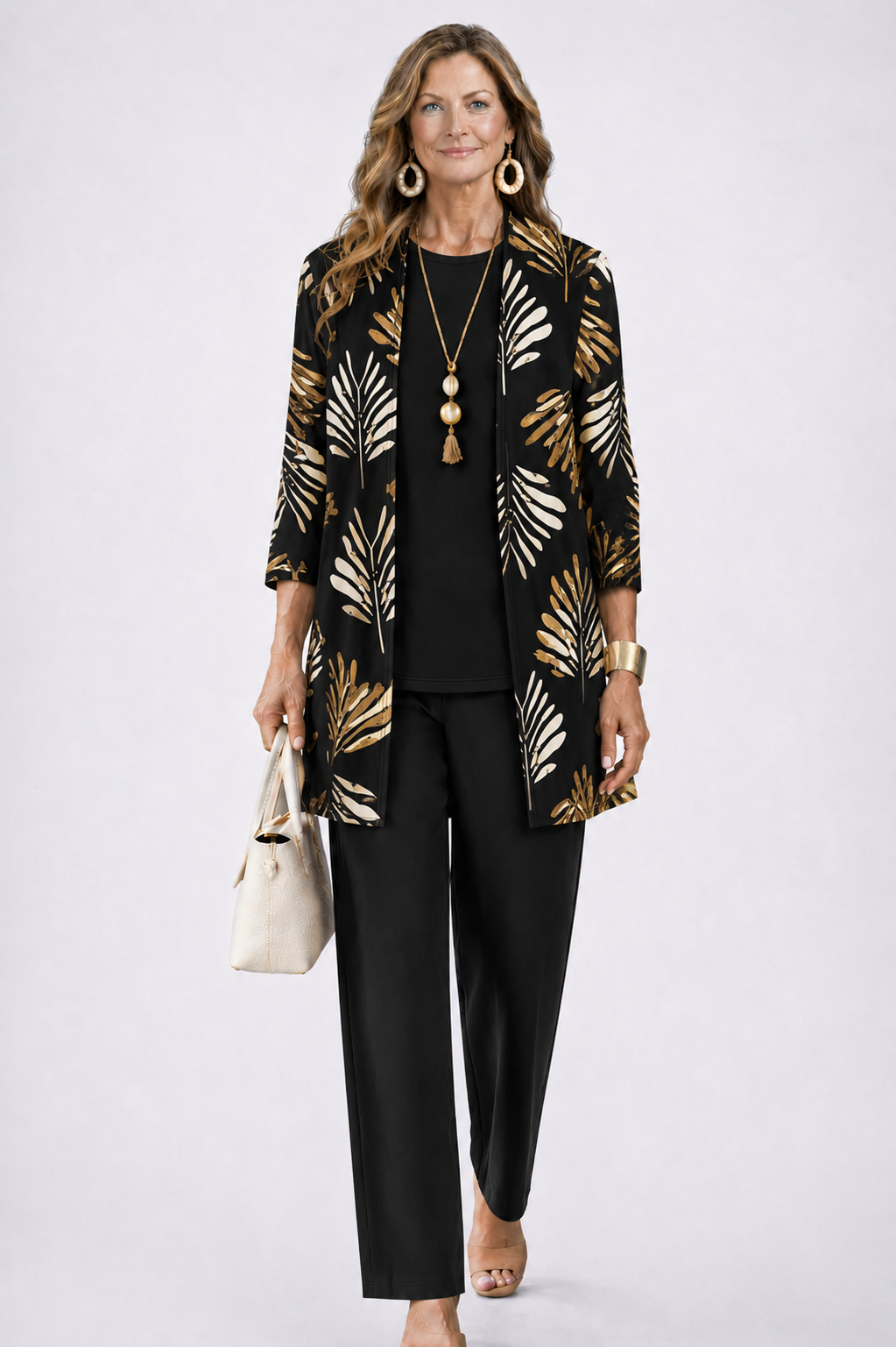 Model wears the black set with gold and cream leaf print on the open cardigan 5