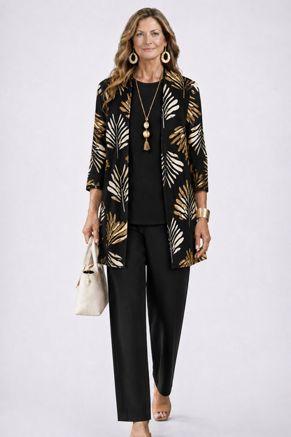 Model wears the black set with gold and cream leaf print on the open cardigan 5