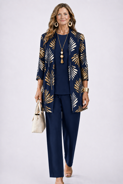 Model wears the navy set, the open cardigan printed with gold and cream palm leaves 7