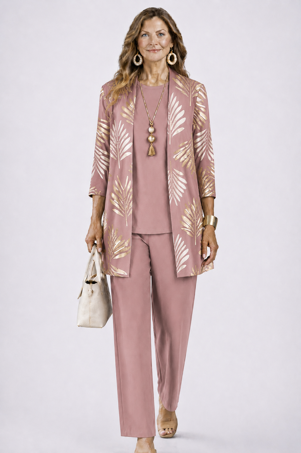 Model wears the dusky pink set with a gold leaf print on the open cardigan 8