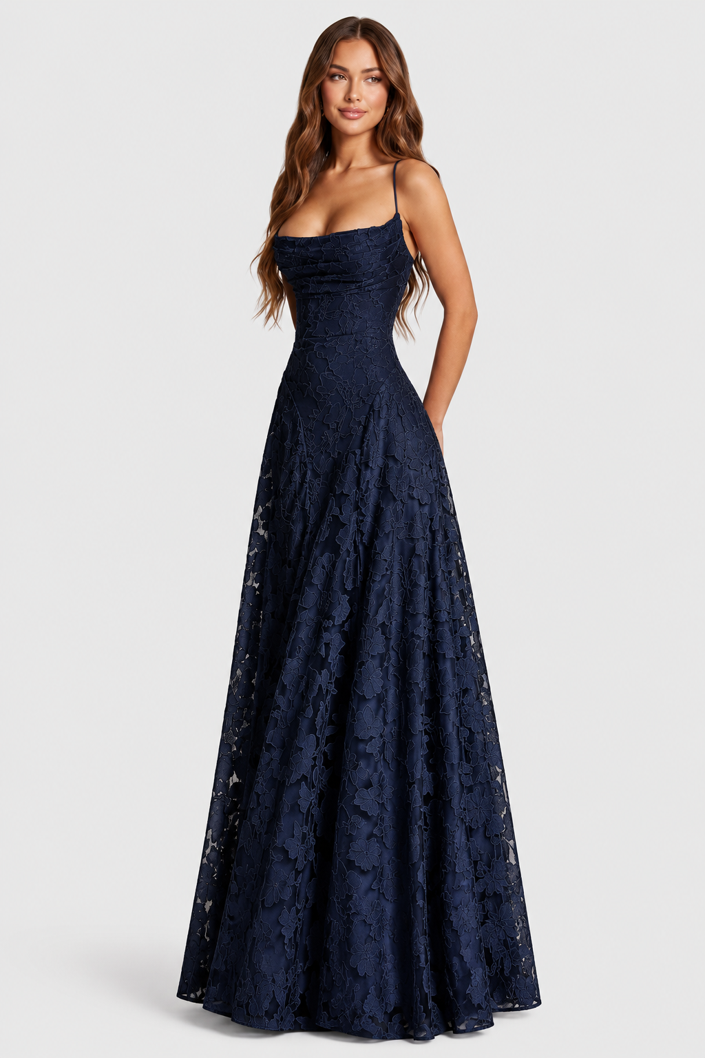 Navy floral lace gown, front three-quarter view, with ruched cowl neckline, thin straps and a full A-line skirt. 12