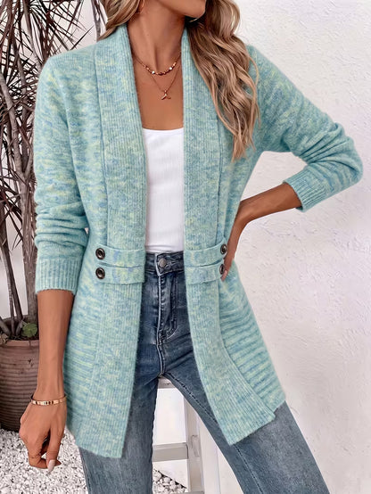 Woman wearing the cardigan in a mottled turquoise and green knit, hand on hip, over a white top 5