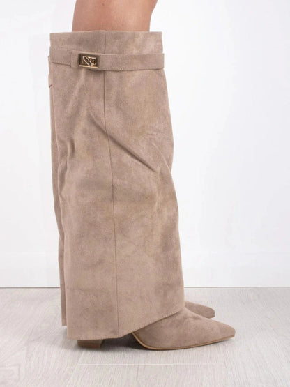 Side profile of a taupe suede-look fold-over knee boot with gold turn-lock strap and pointed toe. 7