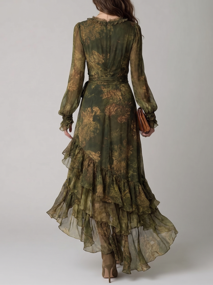 Back view of the dress showing the ruffled collar, concealed zip, waist tie and tiered sheer ruffles cascading down the long skirt. 2