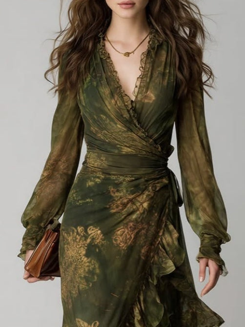 Close-up of the upper half showing the plunging V-neckline with ruffle trim, wrap bodice, sheer long sleeves with ruffled cuffs and side waist tie. 3
