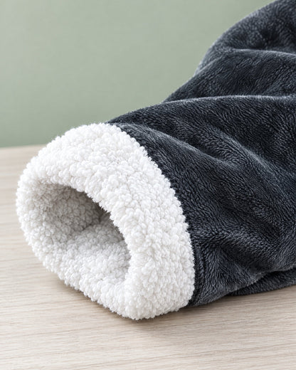 Close-up of a sleeve opening turned back to show the soft white sherpa lining against the plush grey outer fleece. 8
