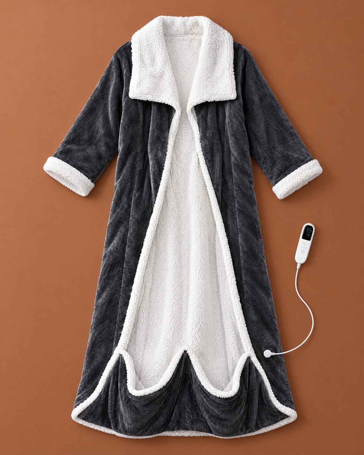 Flat lay of the open dark grey fleece robe with white sherpa lining, collar and cuffs, foot pocket and white controller beside it. 1