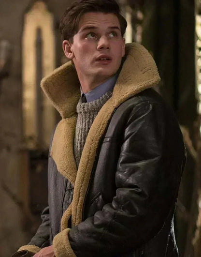 Young man looking upwards, wearing the leather jacket with its tall shearling collar turned up 5