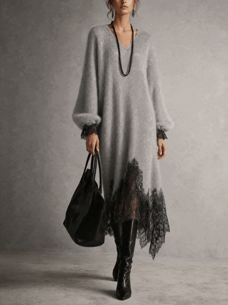 Front view of the grey dress on a model, showing puff sleeves, lace cuffs and asymmetric lace hem 2
