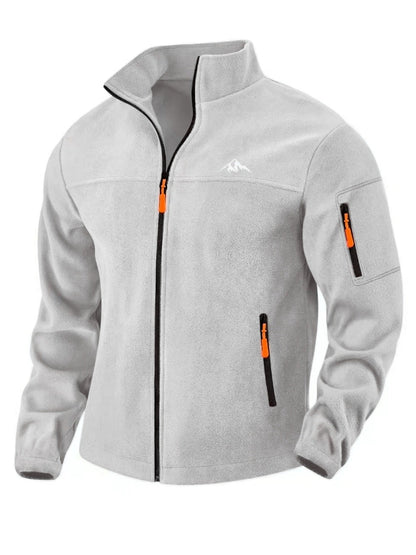Front view of the light grey fleece jacket with orange zip pulls and a zipped sleeve pocket 3