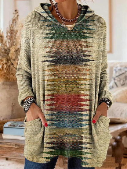 Beige version with a central stripe of pointed green, red and blue patterns running down the front, with large patch pockets. 5