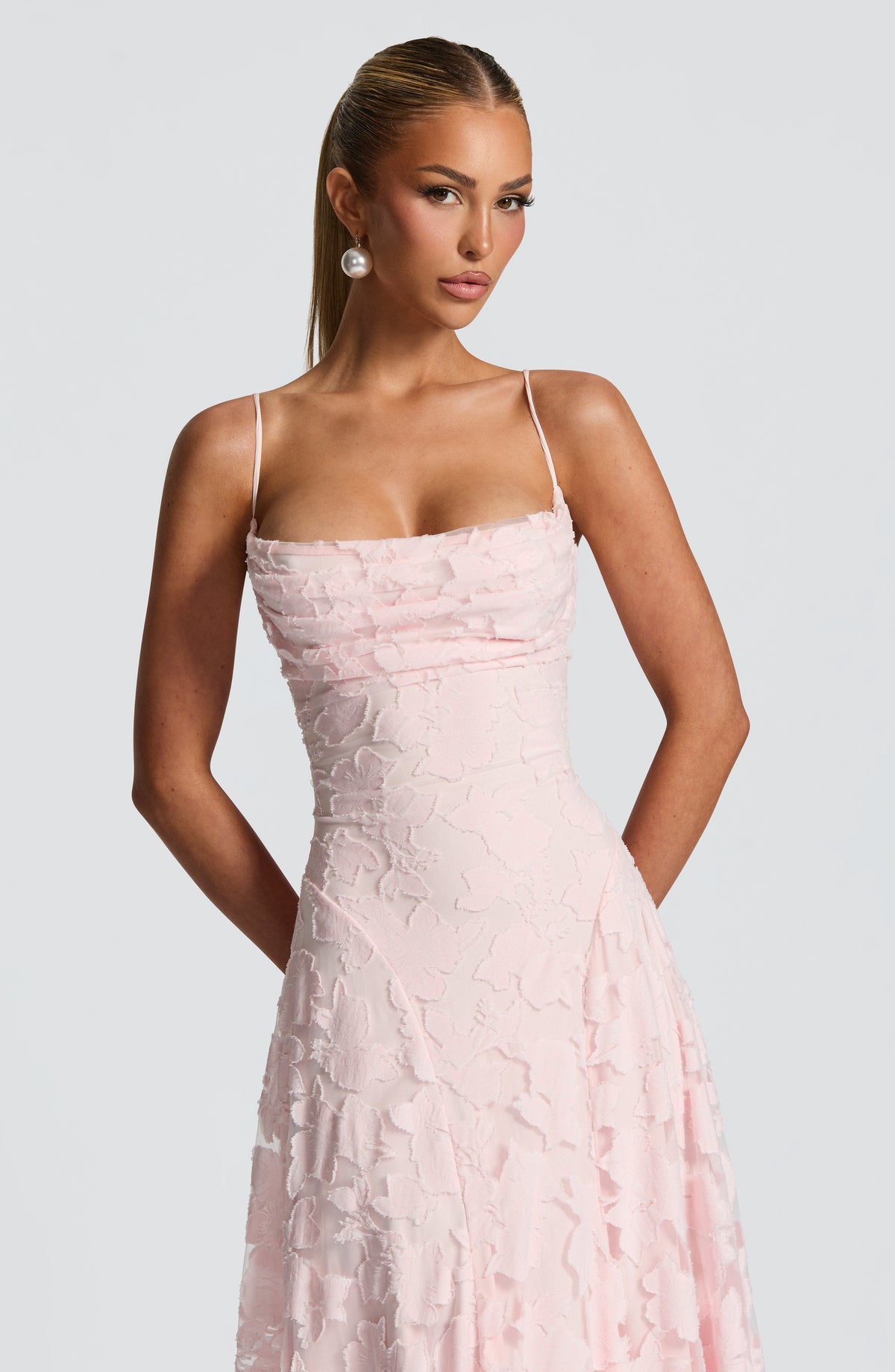 Close-up of the pale pink bodice, showing the draped cowl neckline, thin straps and raw-edged floral texture. 6