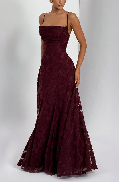 Model wearing the burgundy floral maxi dress at an angle, showing the fitted bodice and flared skirt. 22