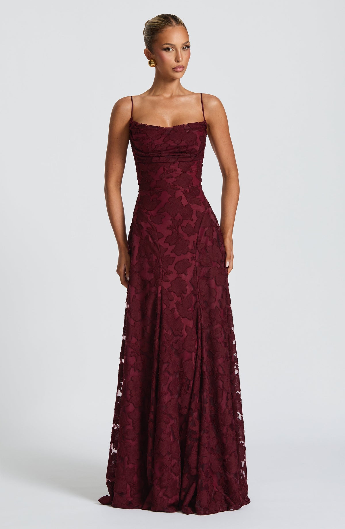Front view of the burgundy floral jacquard maxi dress with a ruched bodice, fitted waist and long skirt. 18