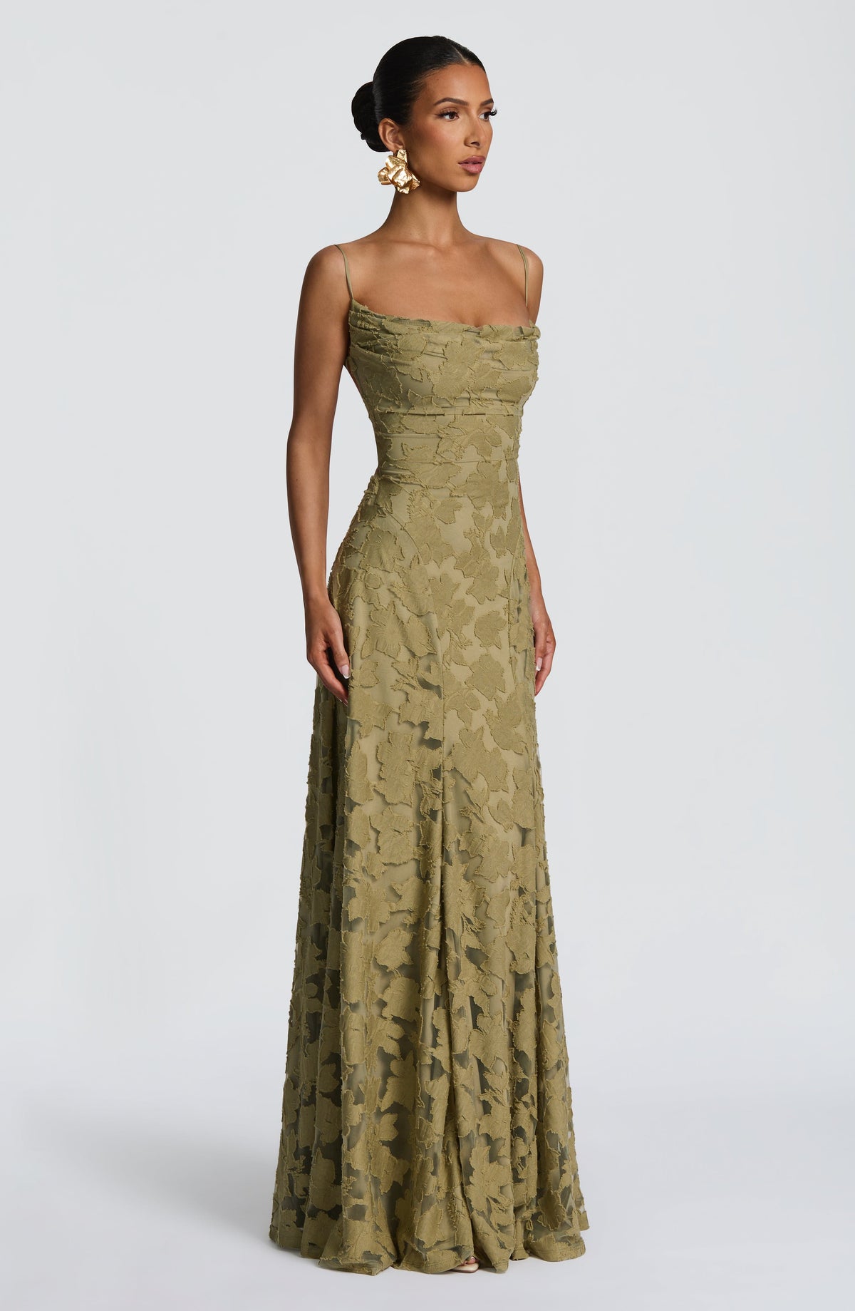 Side view of the olive green maxi dress, showing the cowl neckline, fitted waist and sheer-panelled floral skirt. 30