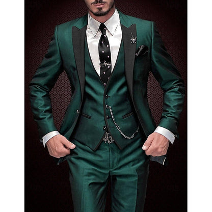 Model in a deep green three-piece suit with black peak lapels, white shirt, patterned black tie and chained waistcoat. 6