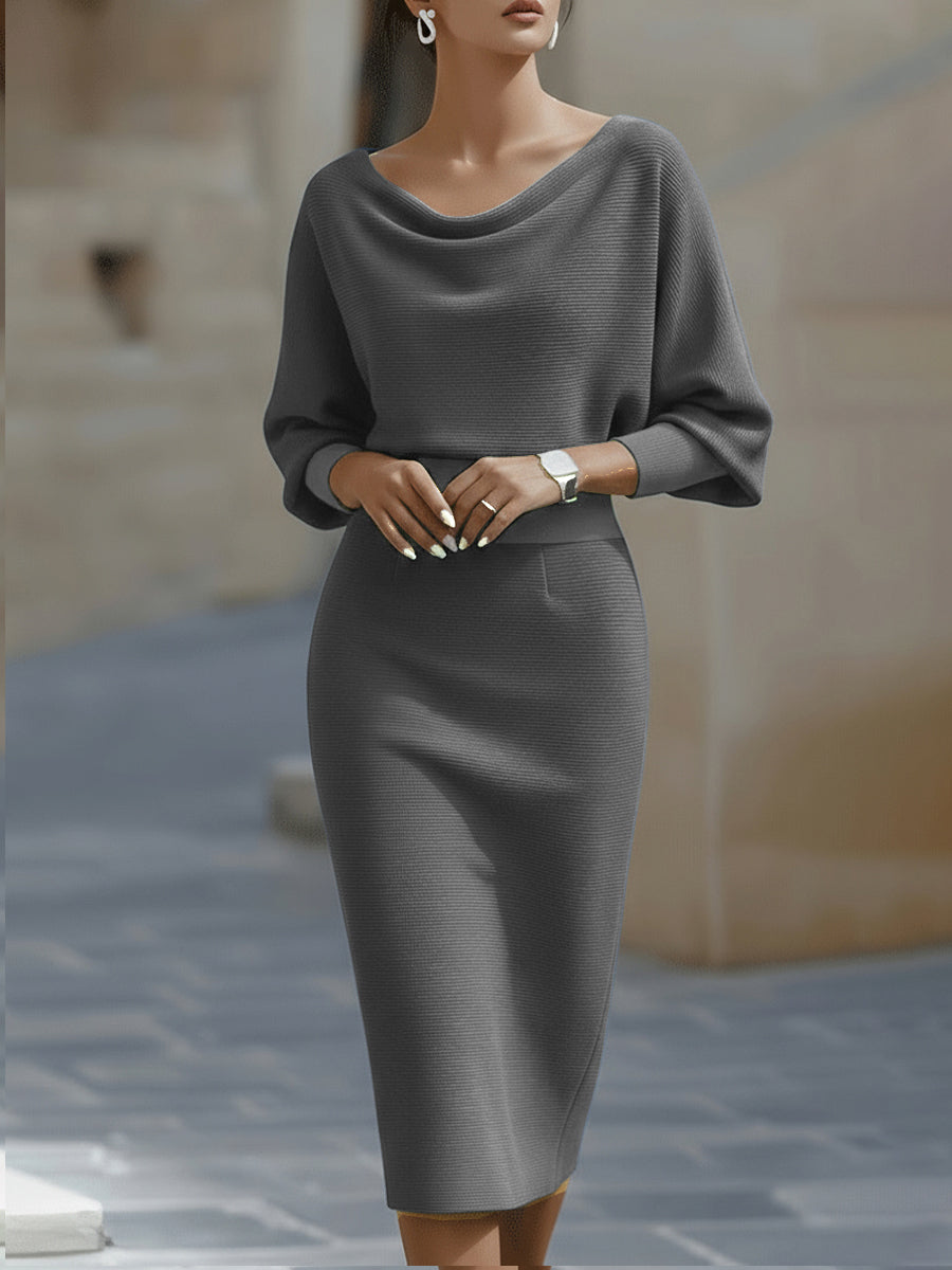 Model wearing the grey version of the dress, front view with fitted waistband and pencil skirt 5