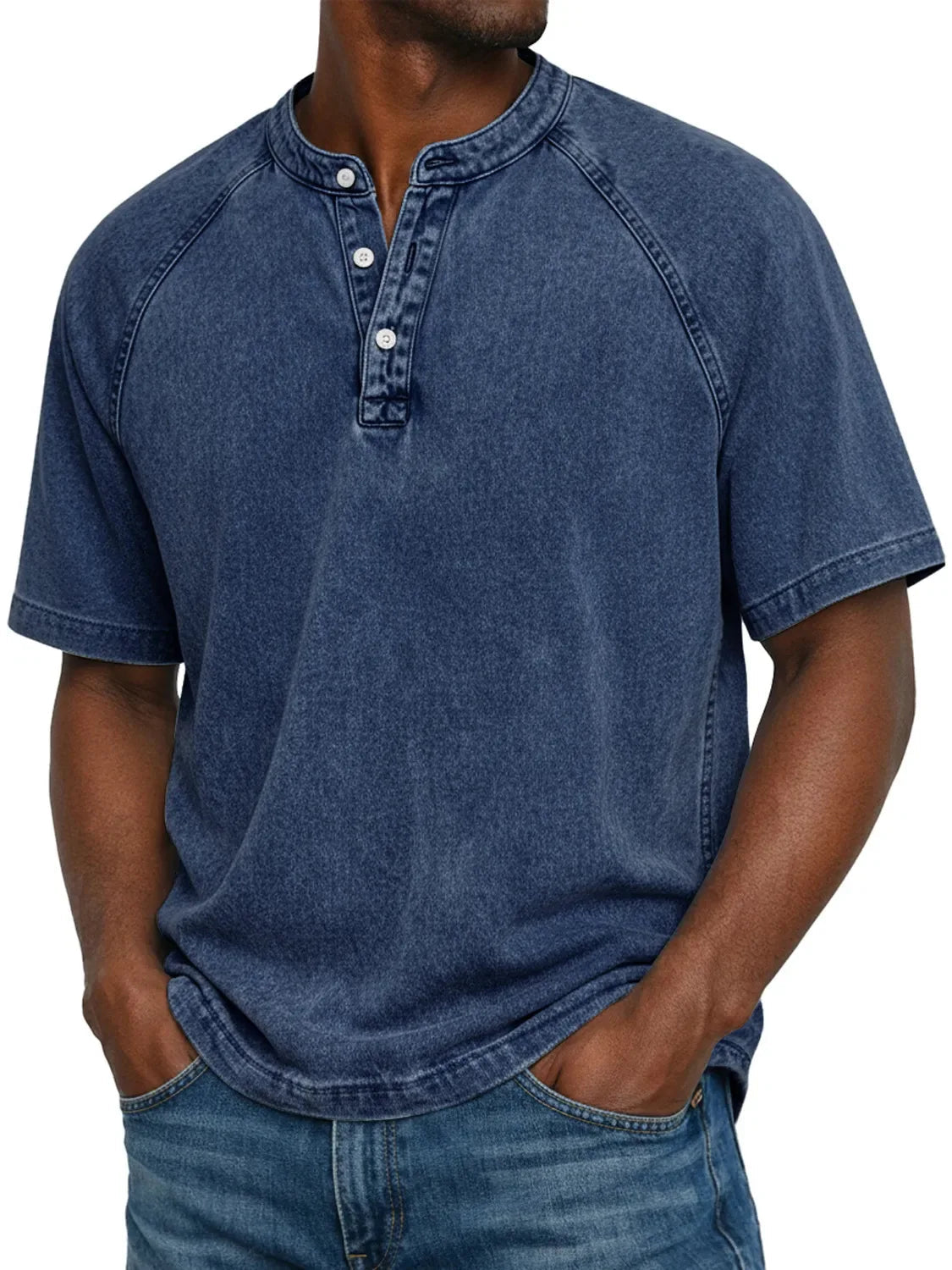 Man wearing the short-sleeved raglan Henley in washed deep navy blue, front view showing the buttoned placket and raglan seams. 3