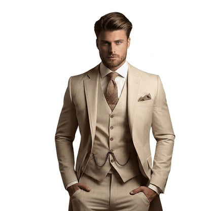 Model in the light beige three-piece suit with faint stripes, waistcoat with chain, white shirt and brown textured tie. 2