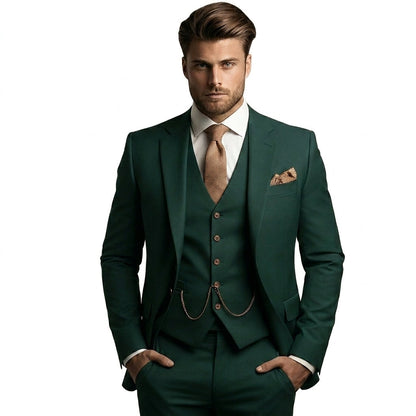 Model in the deep green three-piece suit with waistcoat and chain, white shirt, tan patterned tie and pocket square. 5