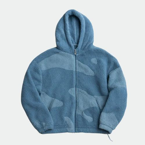 Front view of a zip-up fleece hoodie in blue with a subtle two-tone camouflage-style pattern 3