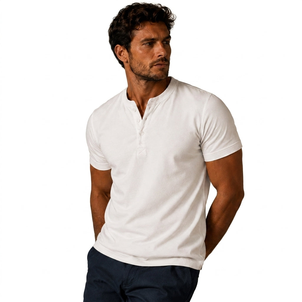 Man wearing the white top with dark navy trousers, standing with hands behind his back, showing the front placket 9